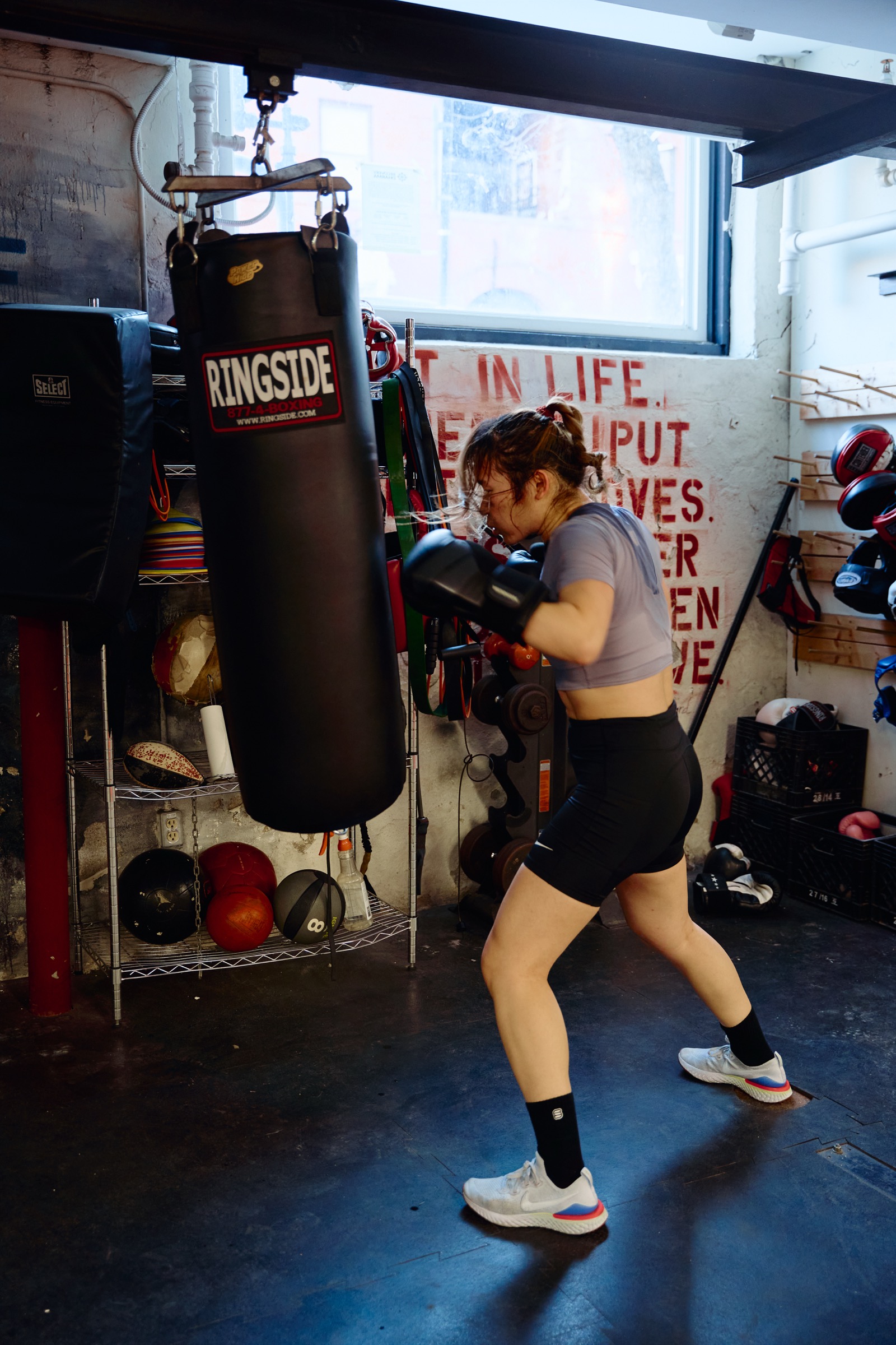 Woman hitting the heavy bag